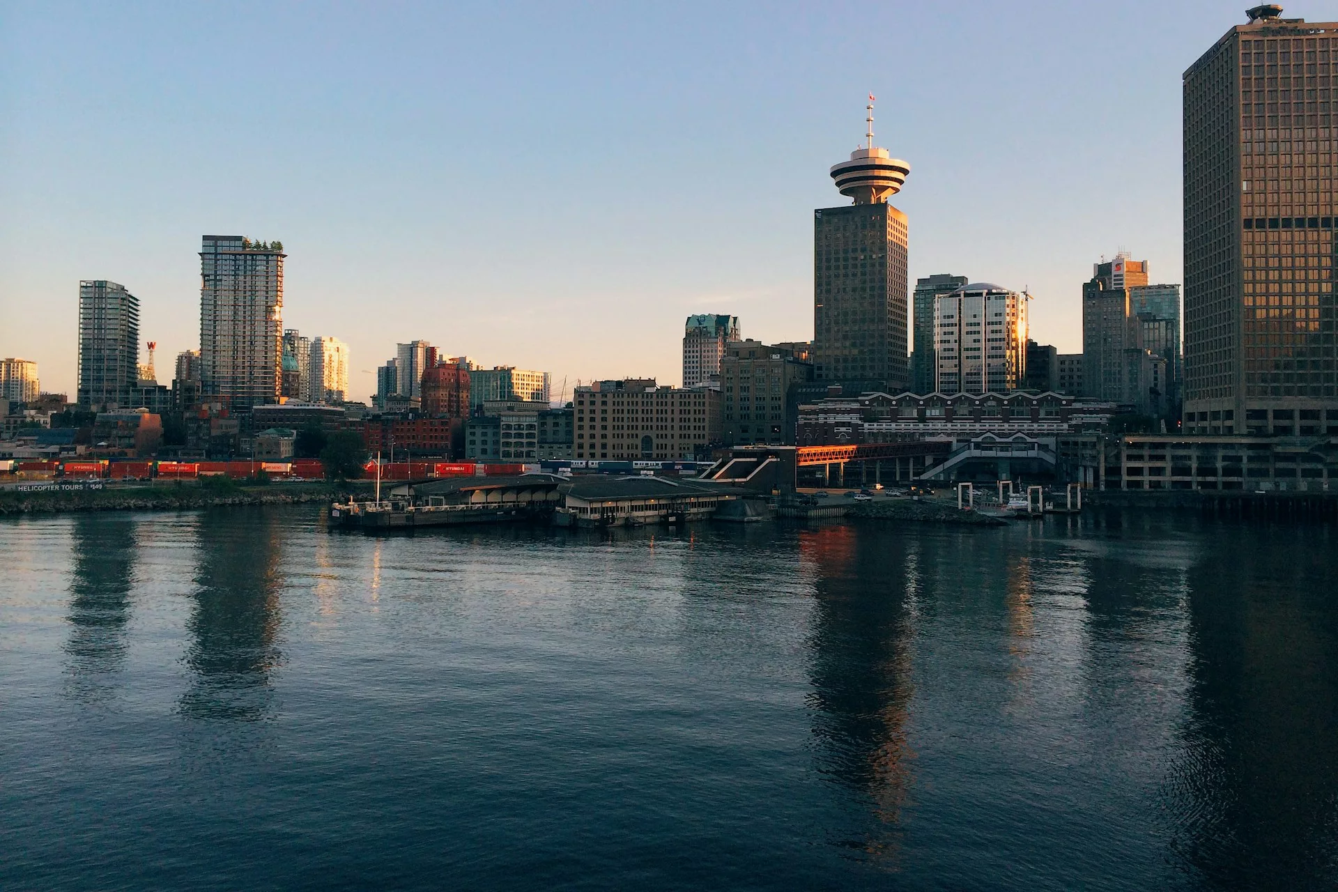 cenic view of Vancouver harbor and cityscape near downtown car rental locations.