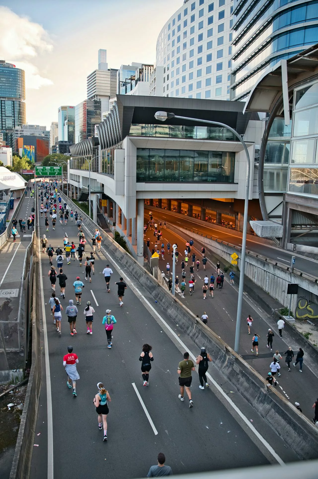 Runners participating in Vancouver Sun Run on downtown city streets.
