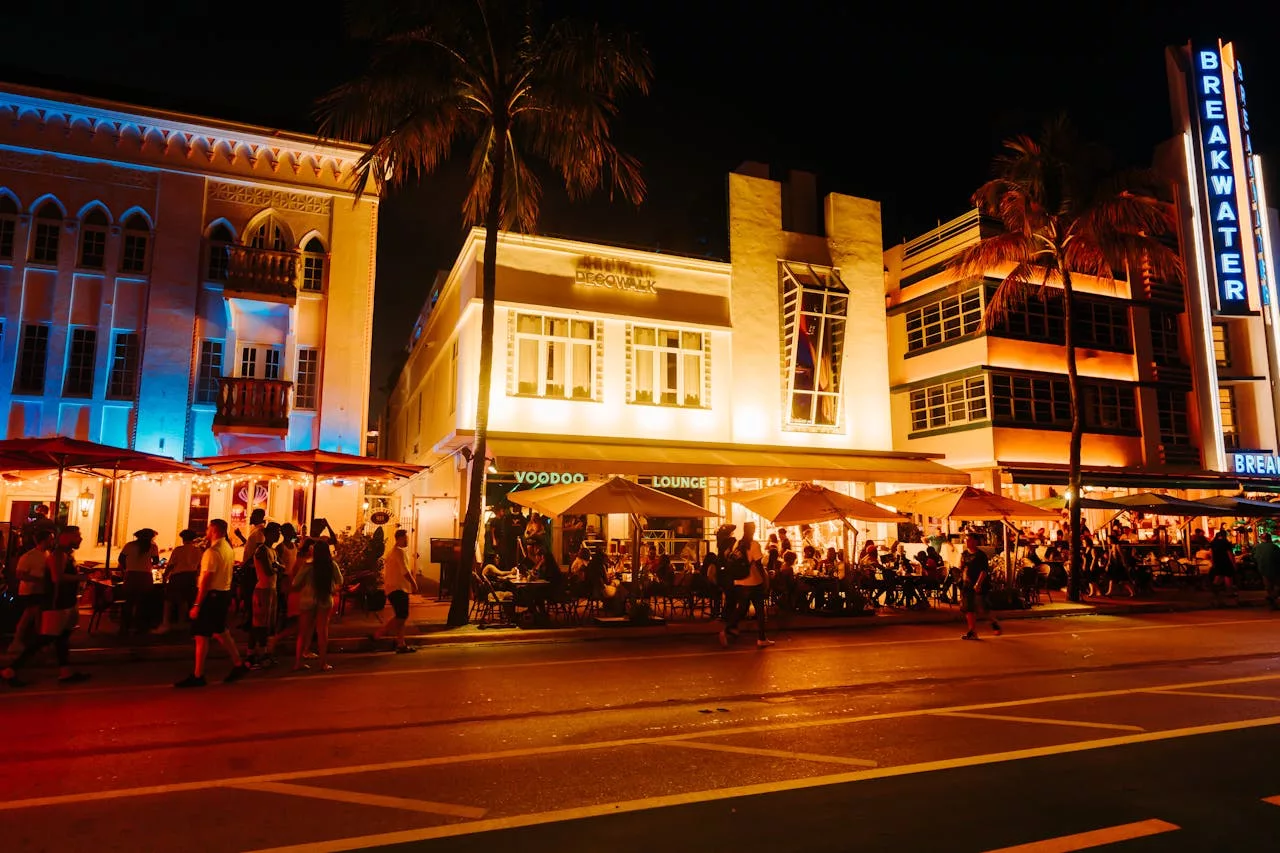 Events in Miami Beach — lively Ocean Drive nightlife with lit Art Deco hotels and crowded sidewalk cafes.