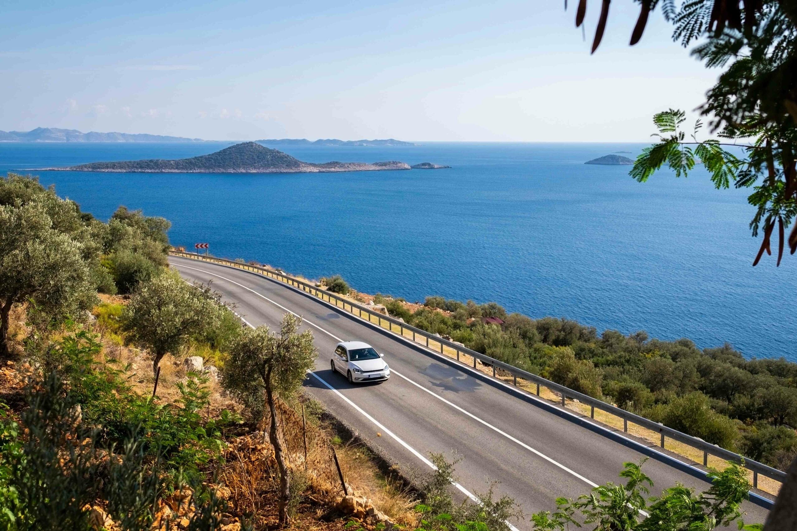 Car rental Vancouver vehicle driving along scenic British Columbia coastal highways in 2026
