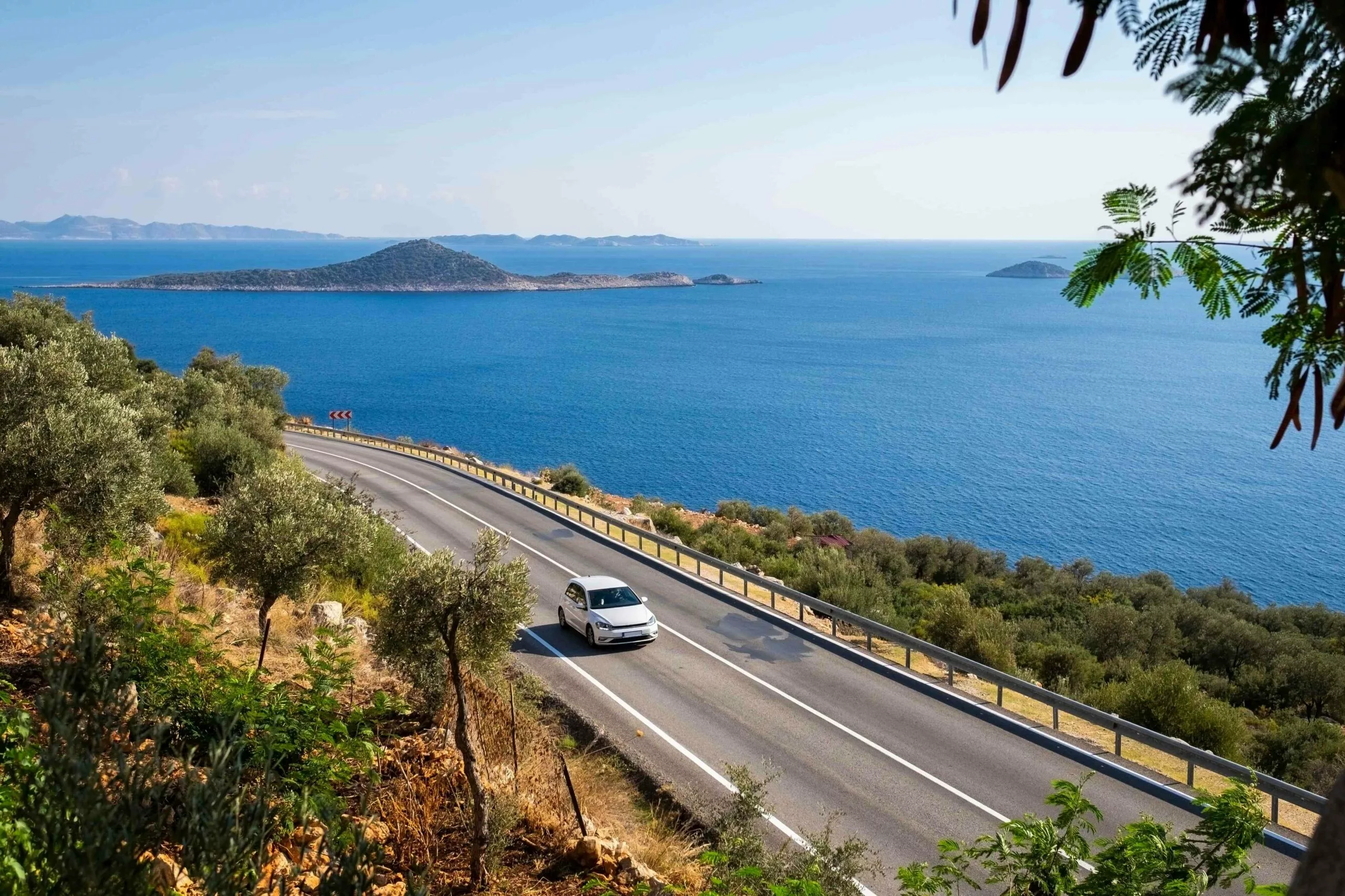 Car rental Vancouver vehicle driving along scenic British Columbia coastal highways in 2026