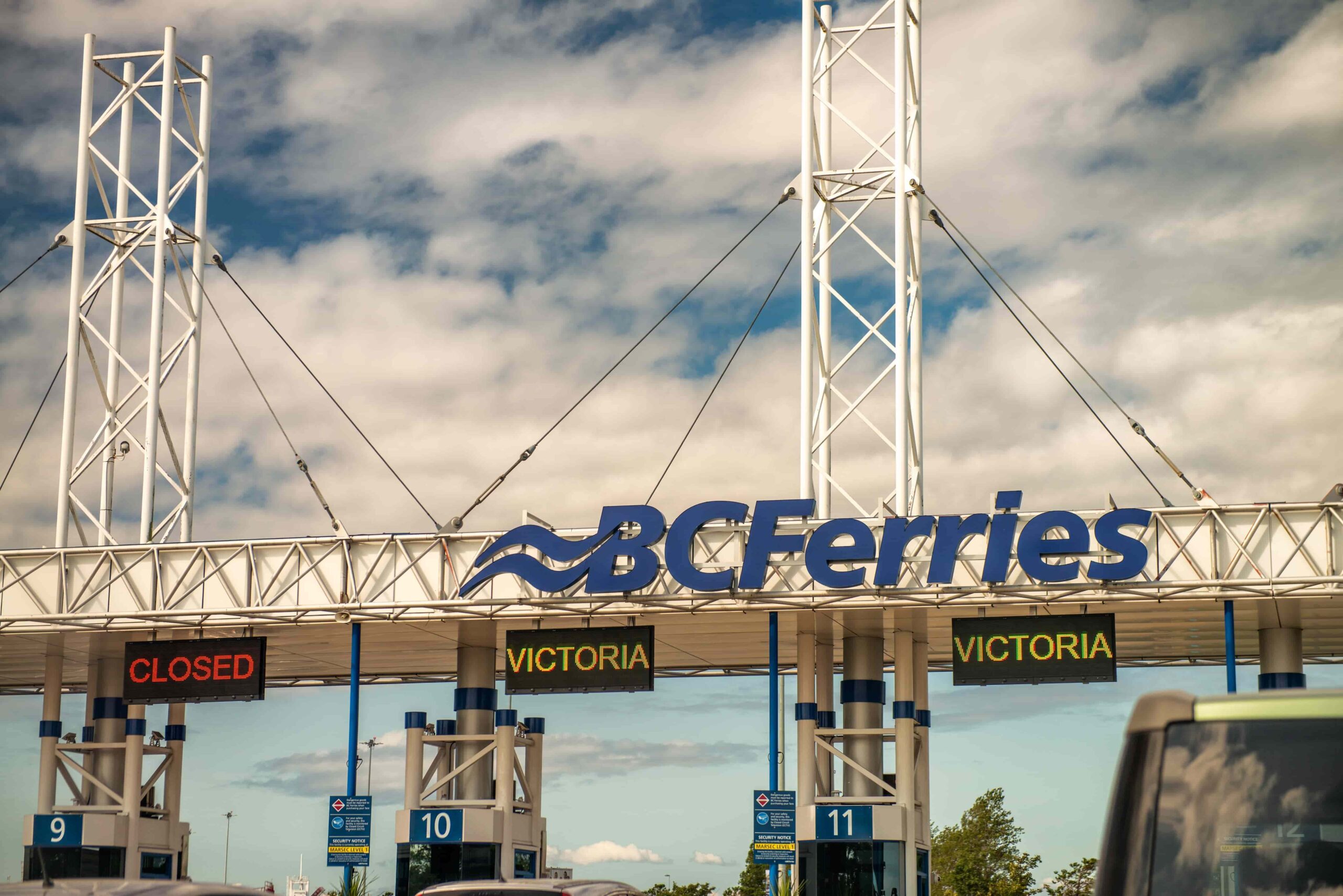 An electric vehicle boarding a BC Ferries vessel at Tsawwassen terminal, illustrating how an EV car rental Vancouver trip extends seamlessly to Vancouver Island