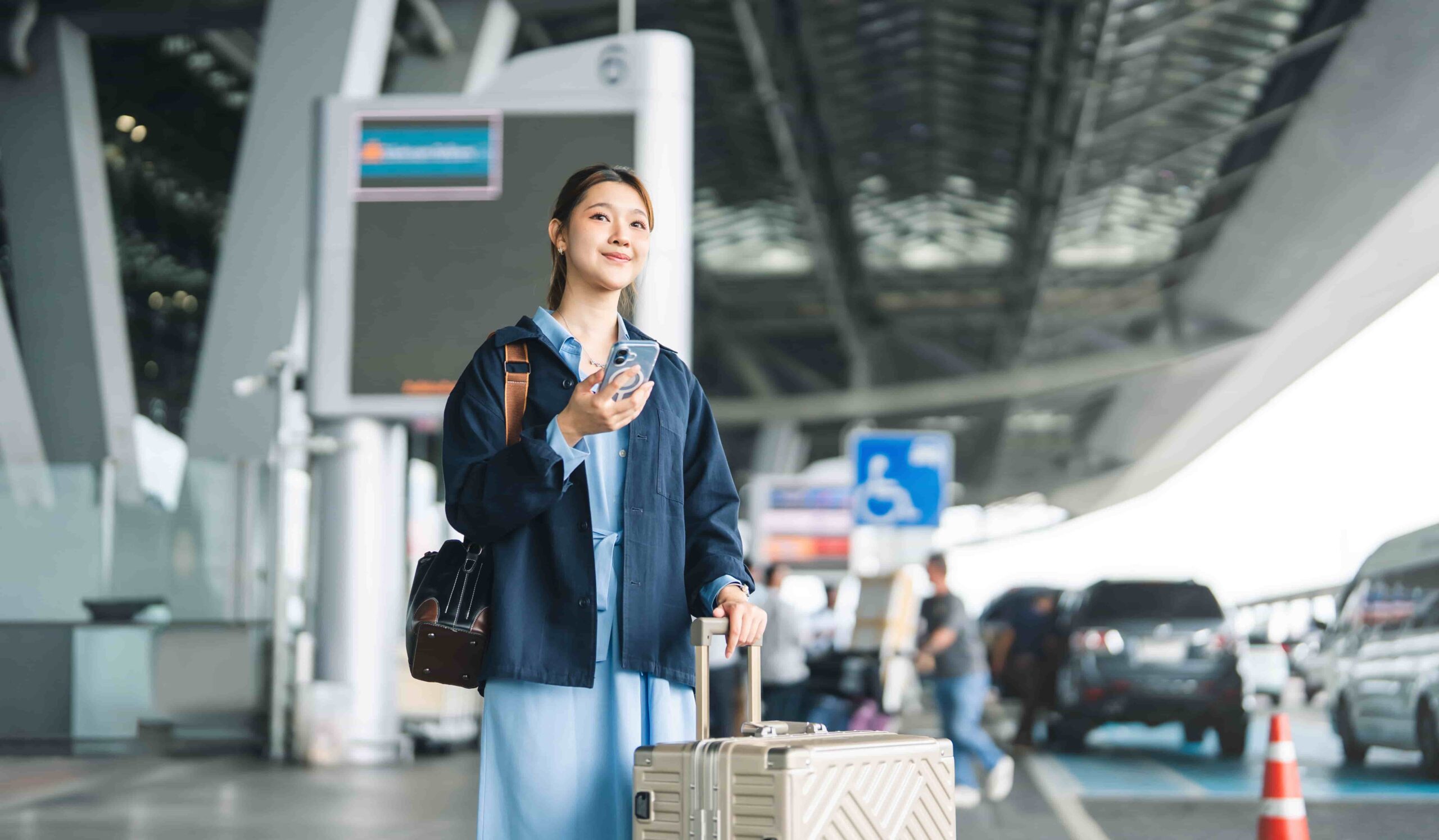 Traveler using a free airport shuttle to reach an off-airport rental car location