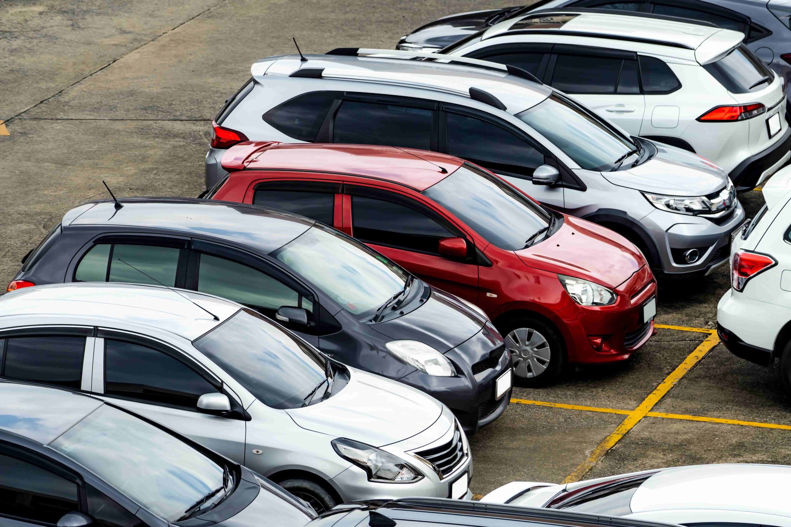 Off-airport car rental fleet with compact cars SUVs and luxury vehicles