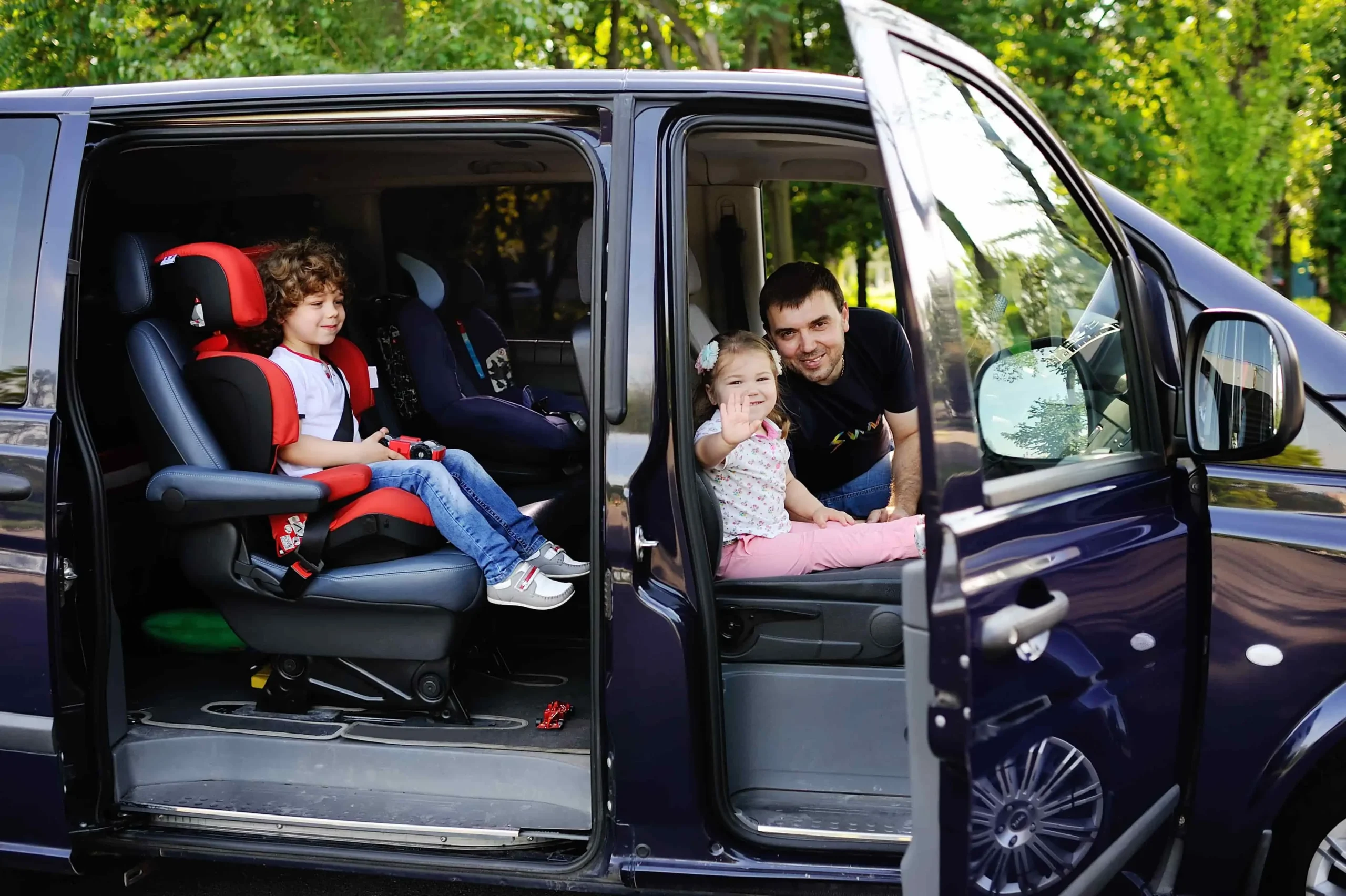 Group car rental with passengers traveling together in a spacious 12-passenger van